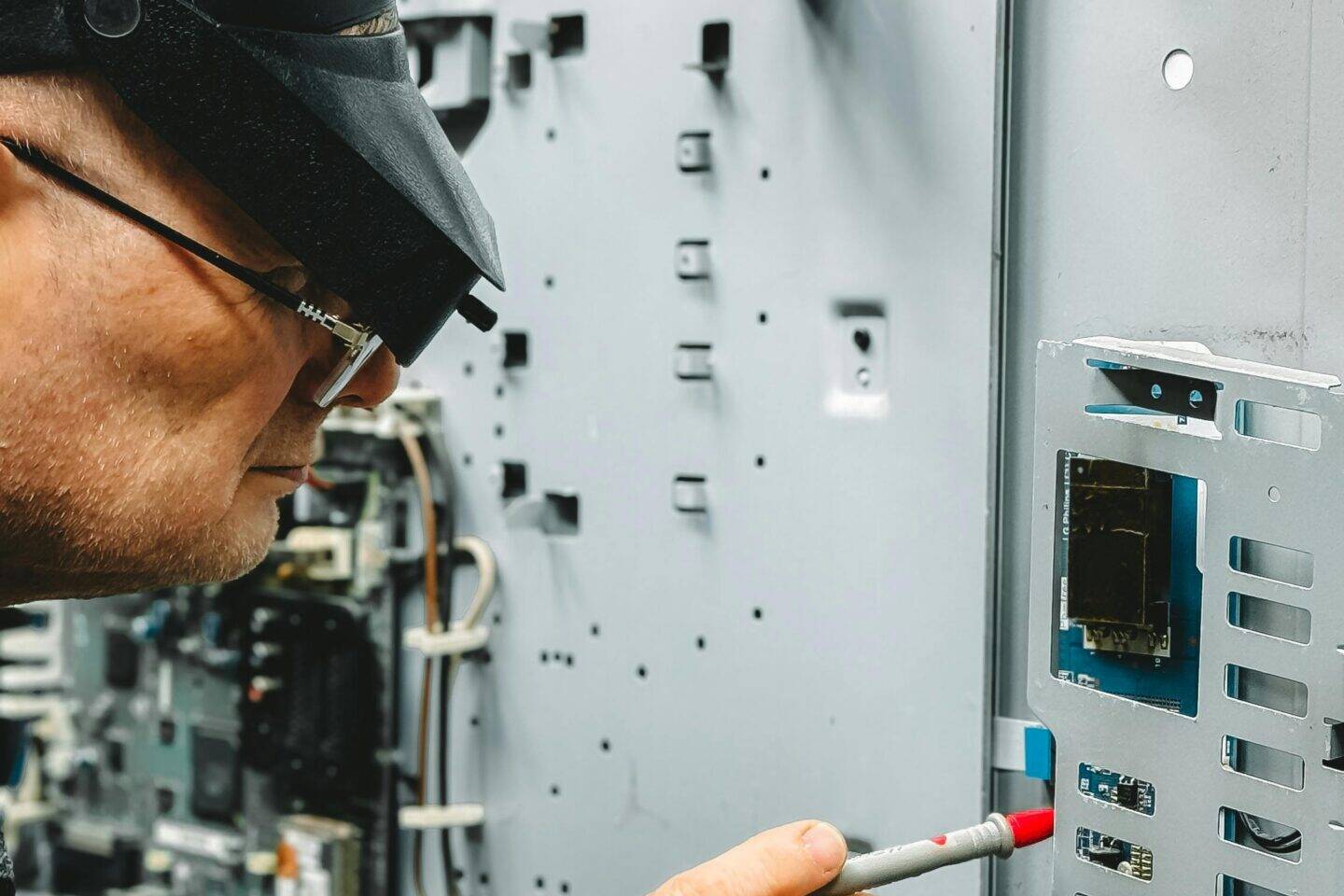 A man doing tests with a multimetermulti-